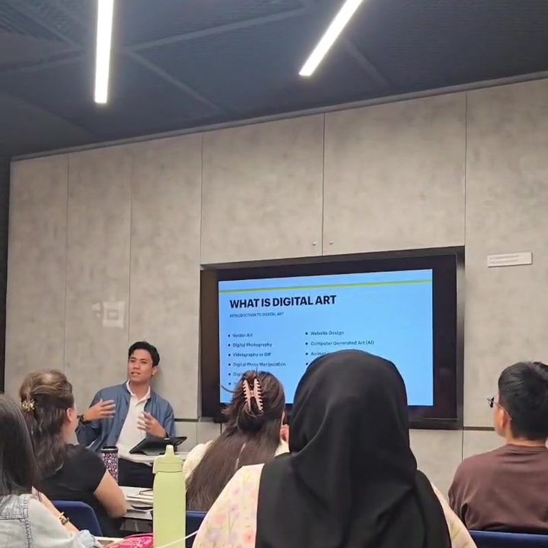 Syed presenting a digital art class